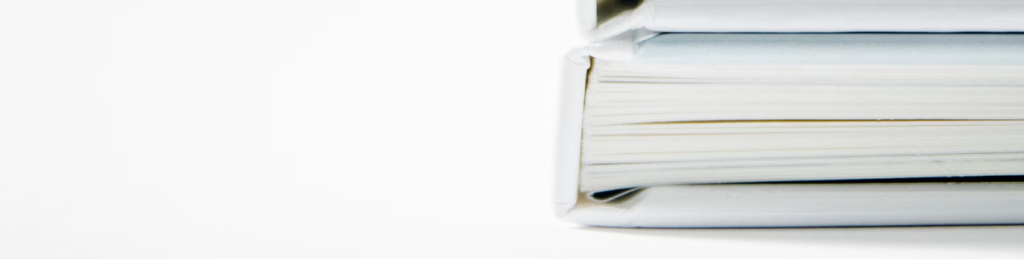 2024 04 03 20 08 49 A Stack Of Thick Folders On A White Surface Photo – Free White Image On Unsplash